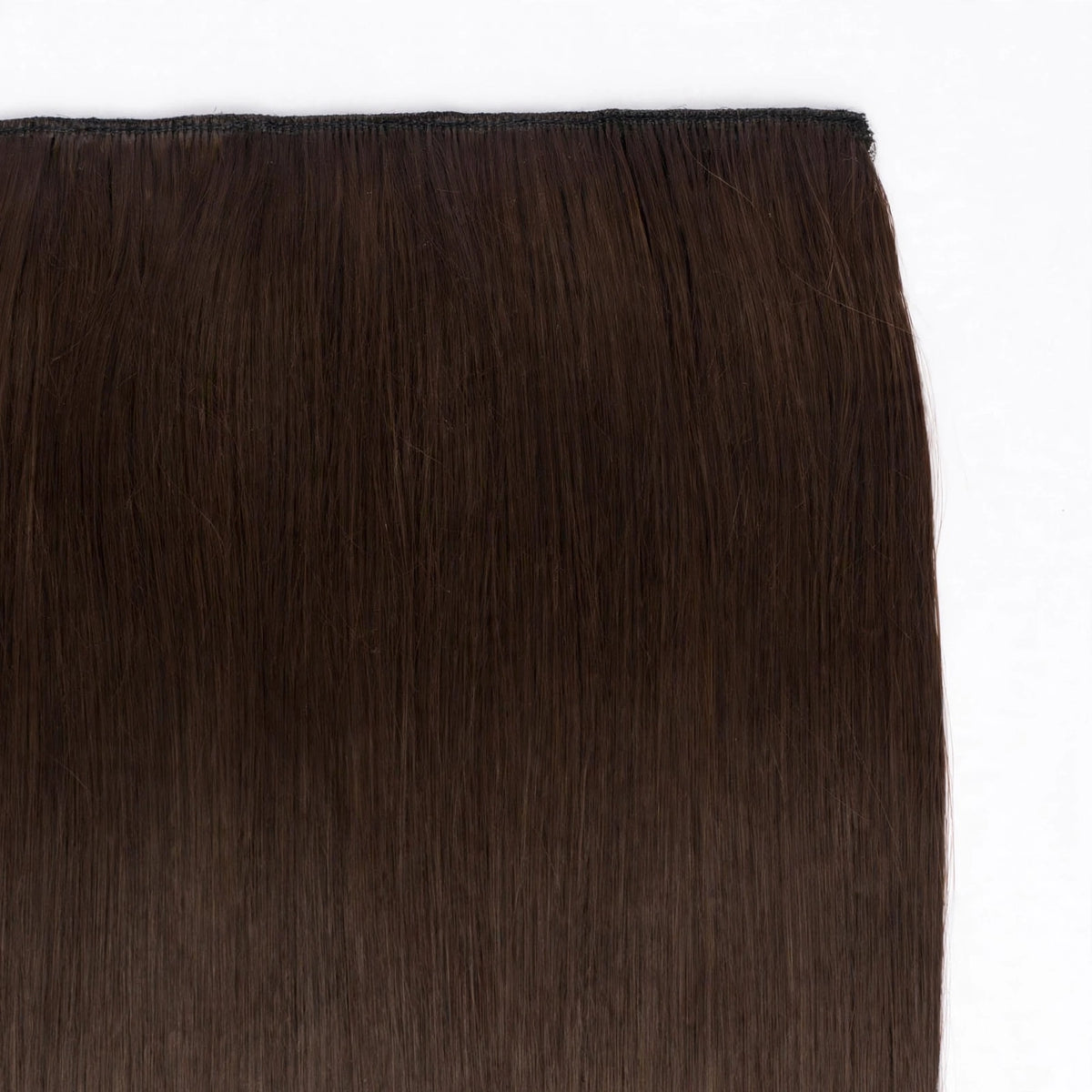 Close-up view of Stranded Hair Group straight clip-in extension in shade #4 Chocolate Dahlia