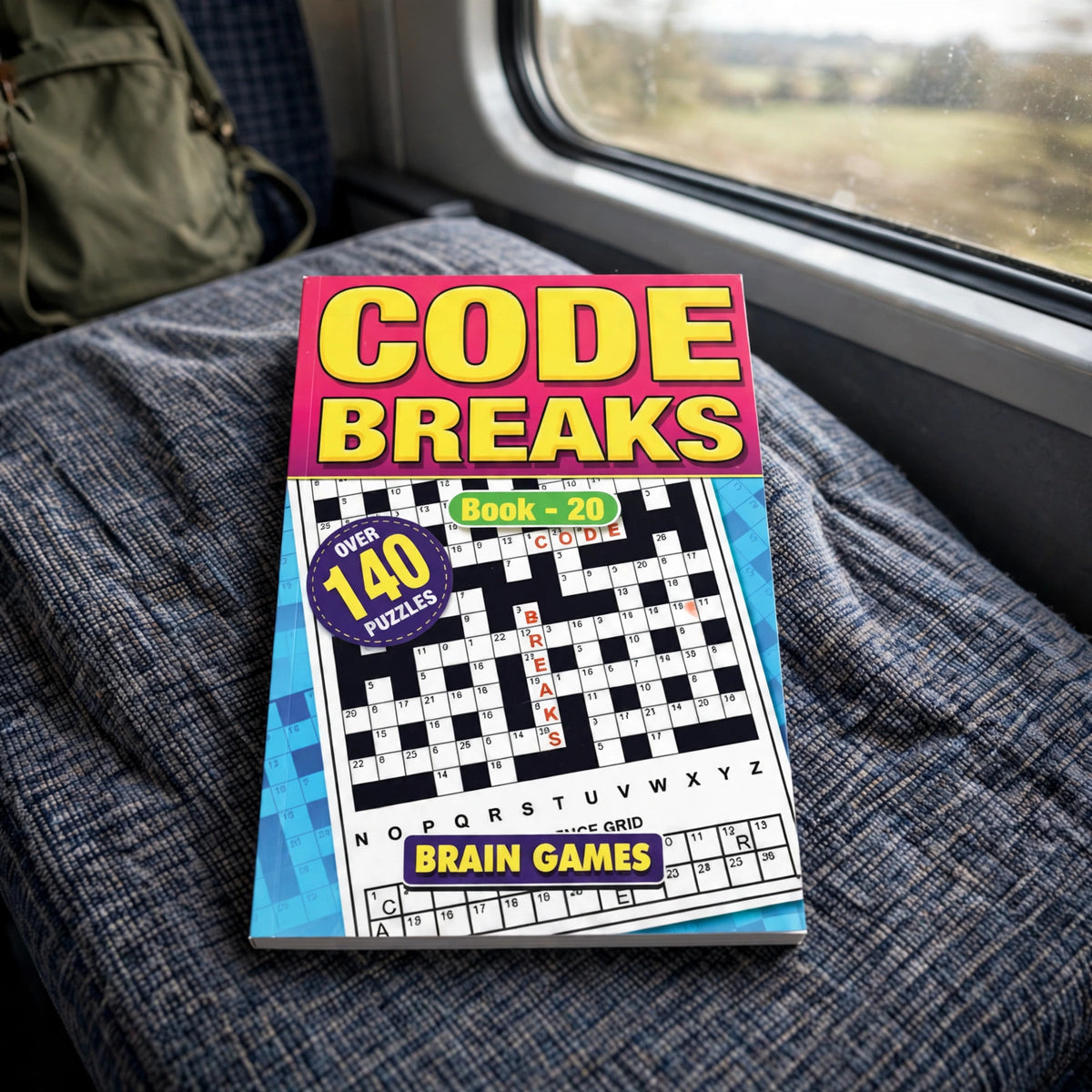 Code Breaks Puzzle Book A5 being used during travel or downtime