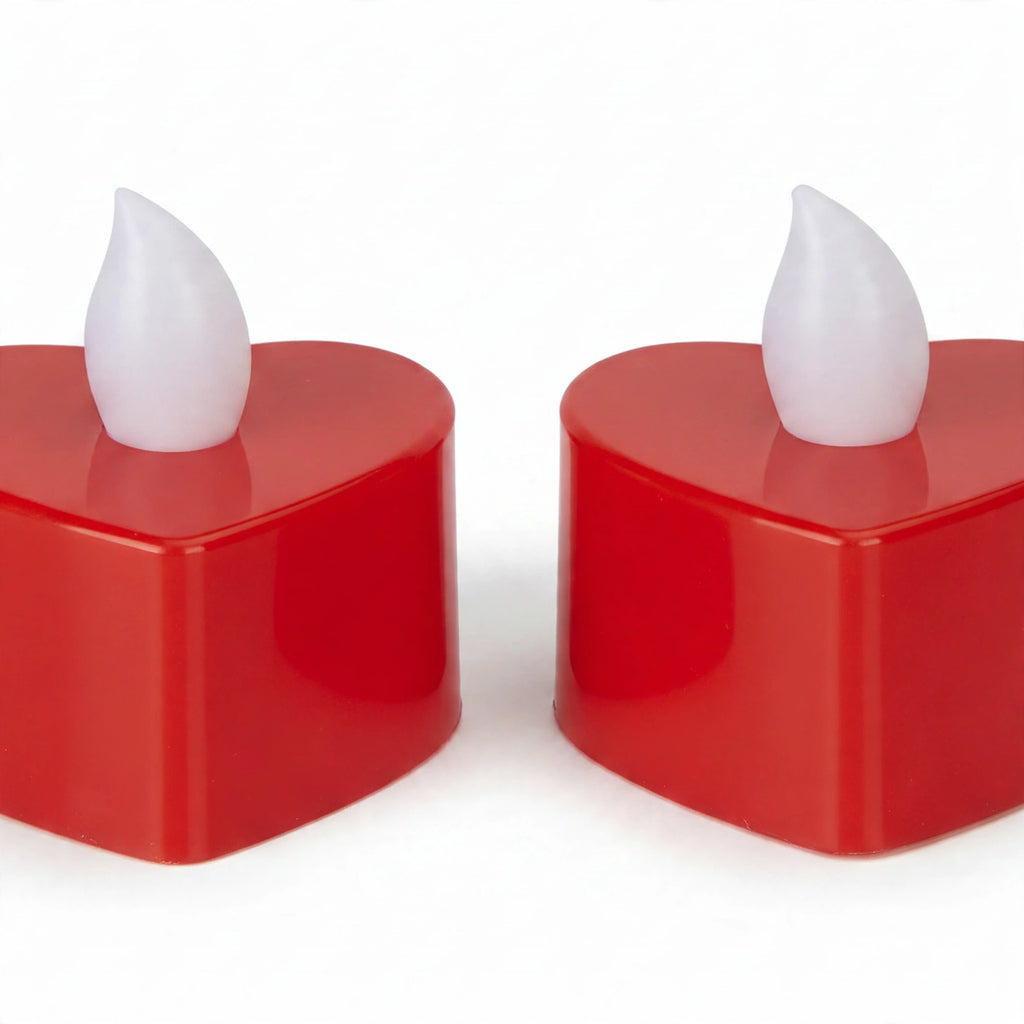 Close-up view of red heart-shaped battery tea light