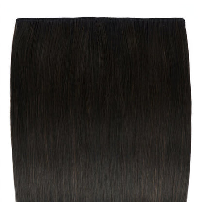 Close-up view of the Stranded Hair Group clip-in extension in black-brown shade #1B Queen of the Night