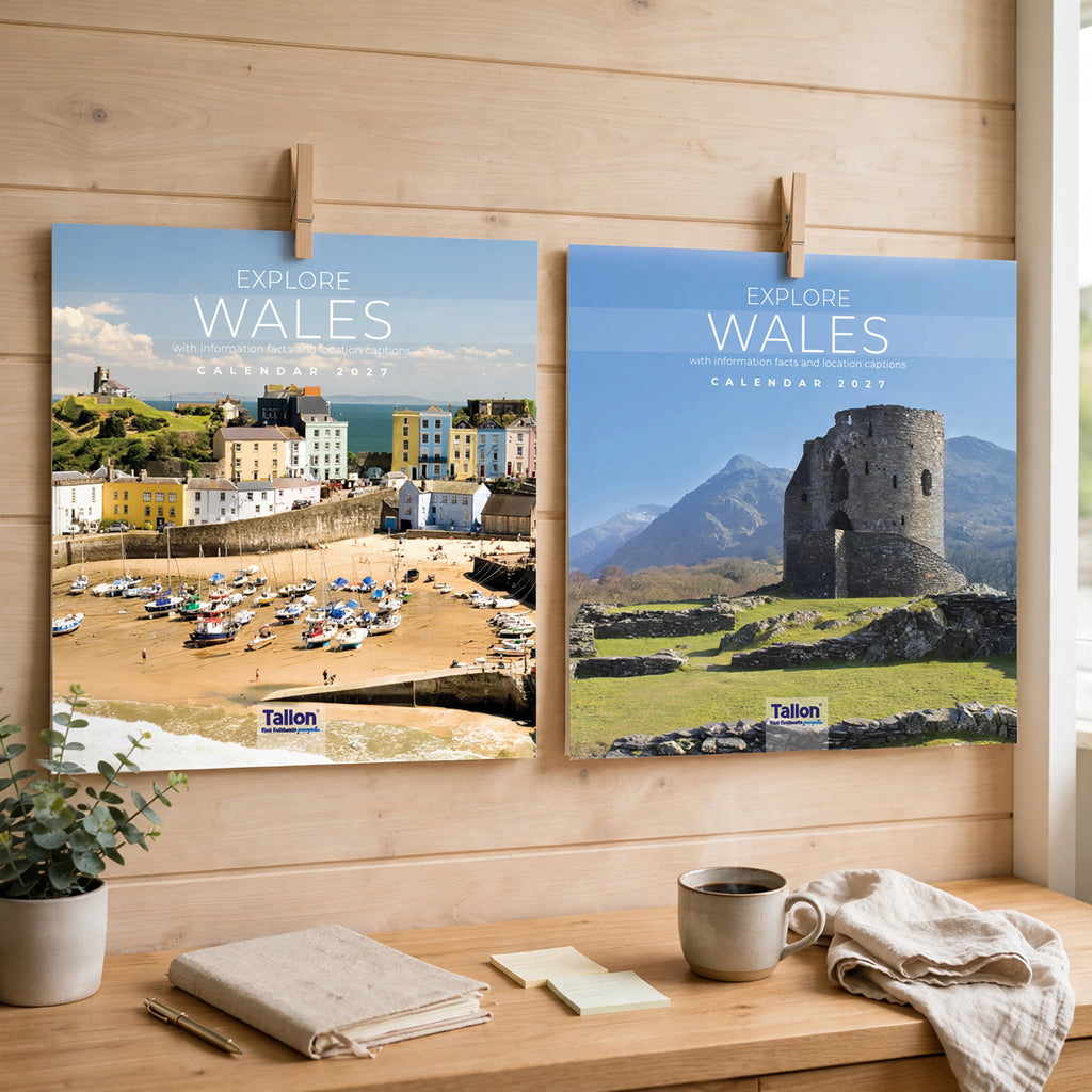 2027 Calendar Square Explore Wales displayed on a wall in a home office or kitchen