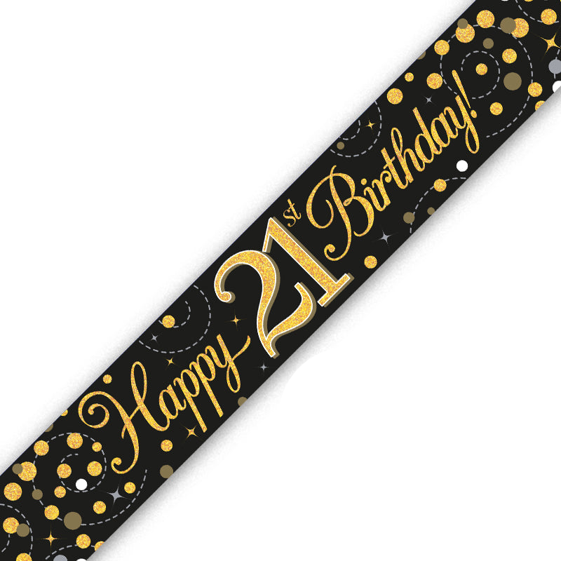 A black 21st birthday party banner with gold glitter-style lettering reading 'Happy 21st Birthday!' and gold confetti dots, shown diagonally on a white background.