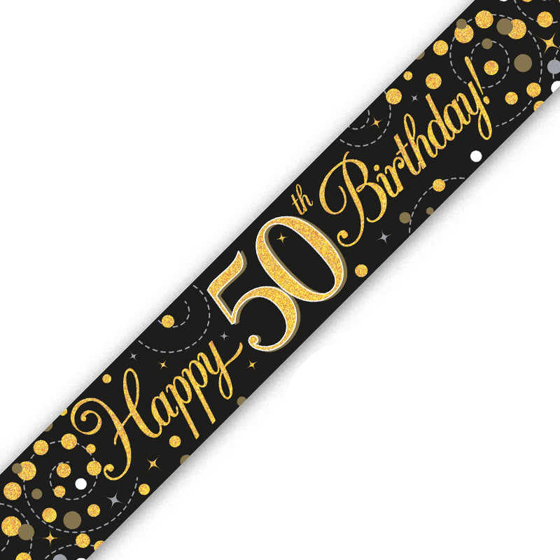 A black and gold 50th birthday banner or sash printed with 'Happy 50th Birthday!' in elegant gold script and decorated with gold and white confetti dots on a white background.