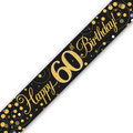 A black 60th birthday banner or sash printed with 'Happy 60th Birthday!' in gold script and gold glitter-style numbers, decorated with gold and white confetti dots on a white background.