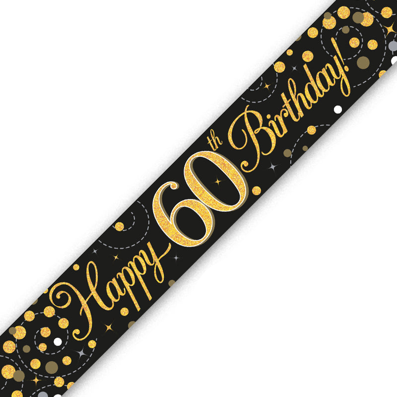 A black 60th birthday banner or sash printed with 'Happy 60th Birthday!' in gold script and gold glitter-style numbers, decorated with gold and white confetti dots on a white background.