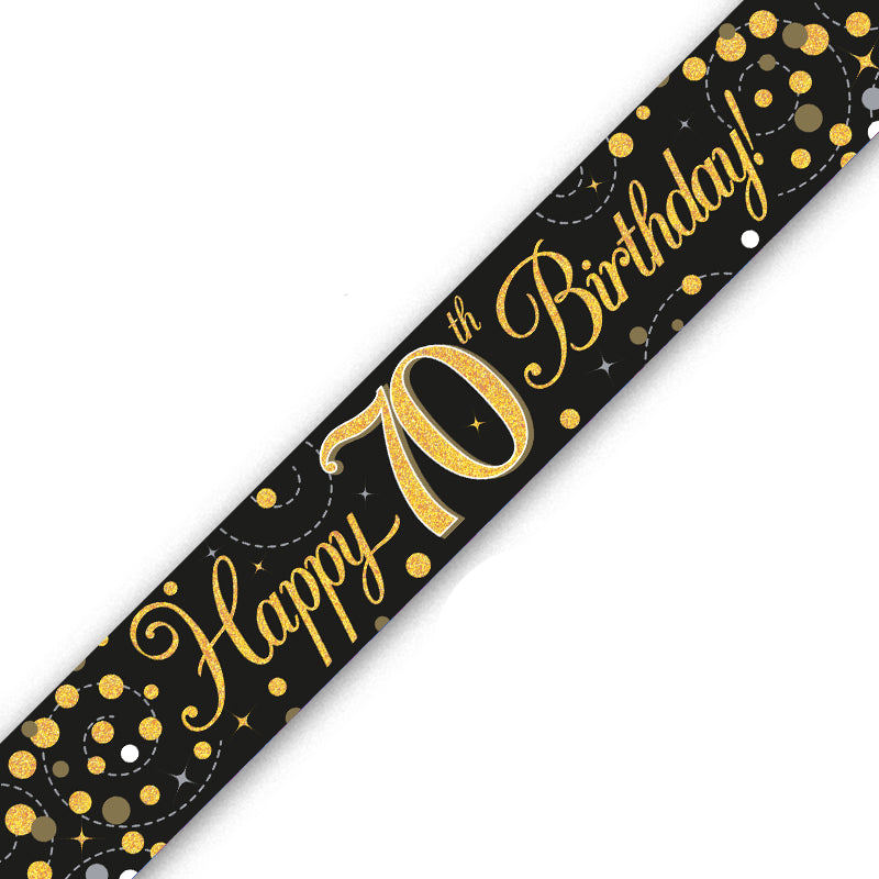 A black 70th birthday banner with metallic gold glitter lettering that reads 'Happy 70th Birthday!' and scattered gold, silver, and white confetti details, shown diagonally on a white background.