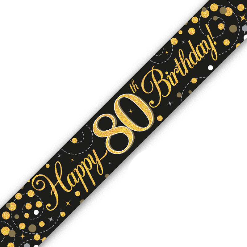 A diagonal black banner with gold glitter-style lettering that reads 'Happy 80th Birthday!' and gold, white, and gray confetti accents, shown on a plain white background.