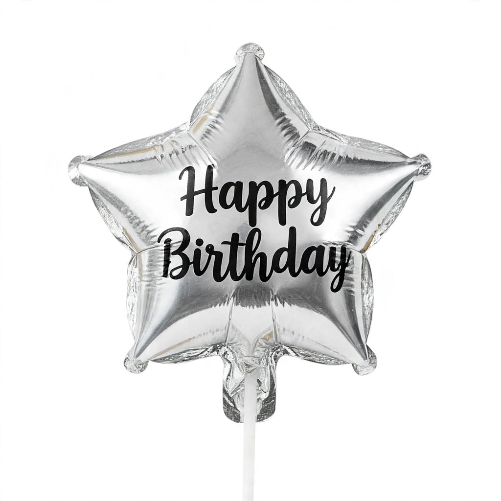 Close-up of assorted silver birthday candles with different designs