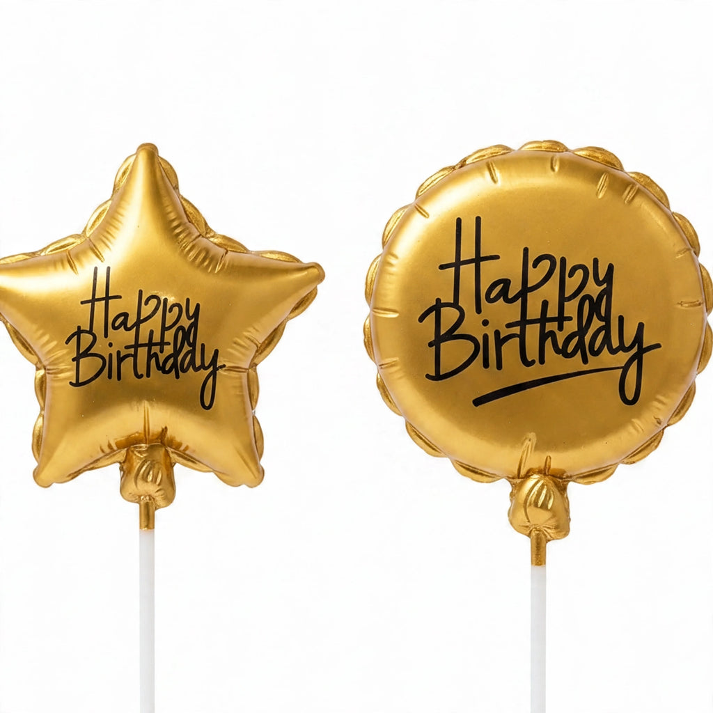 Close-up view of assorted gold birthday candles with steady flames