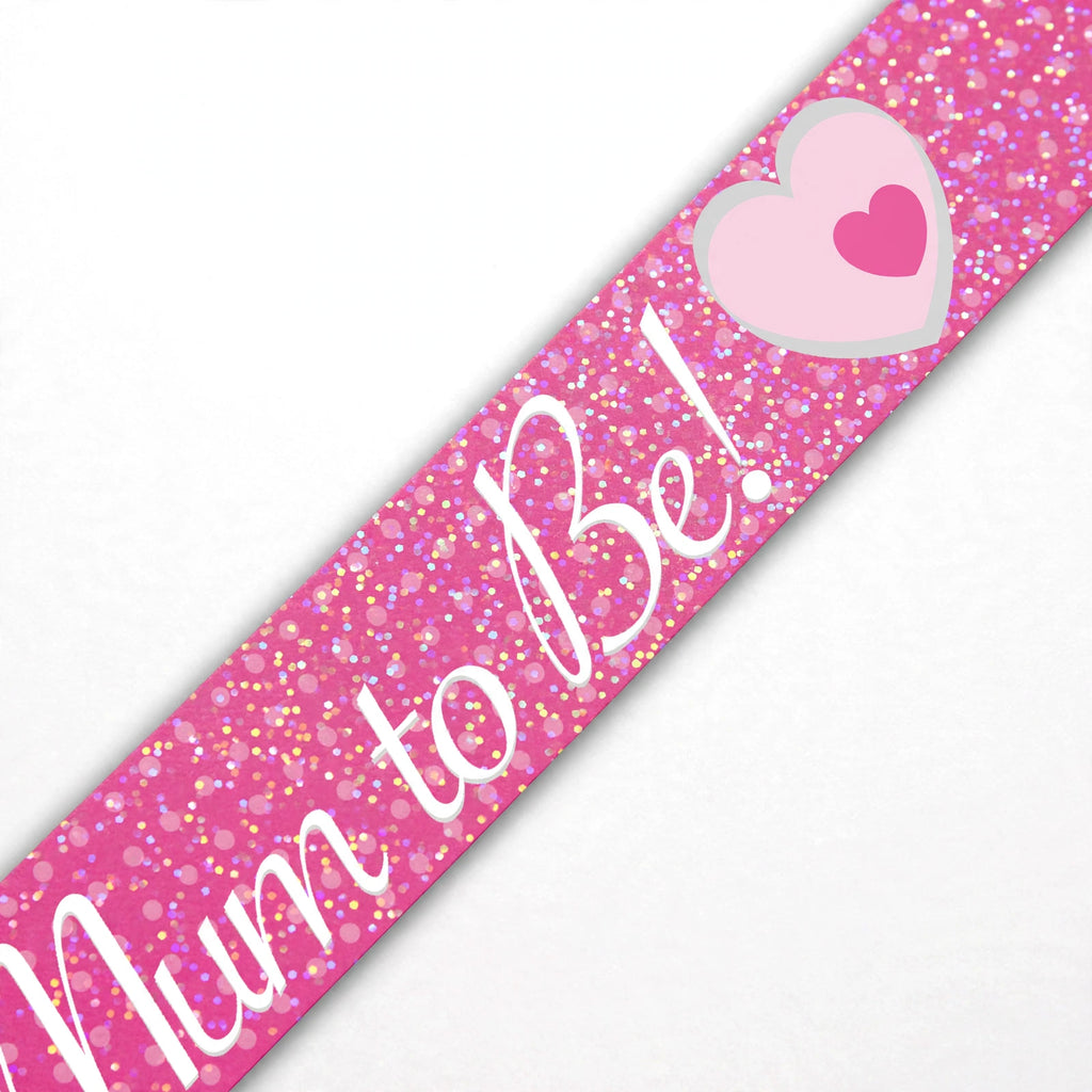 close-up of Mum To Be banner showing holographic silver finish and printed text