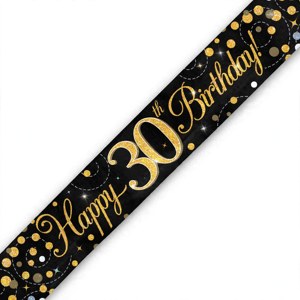 Close-up of black and gold 30th birthday banner with sparkling fizz detailing