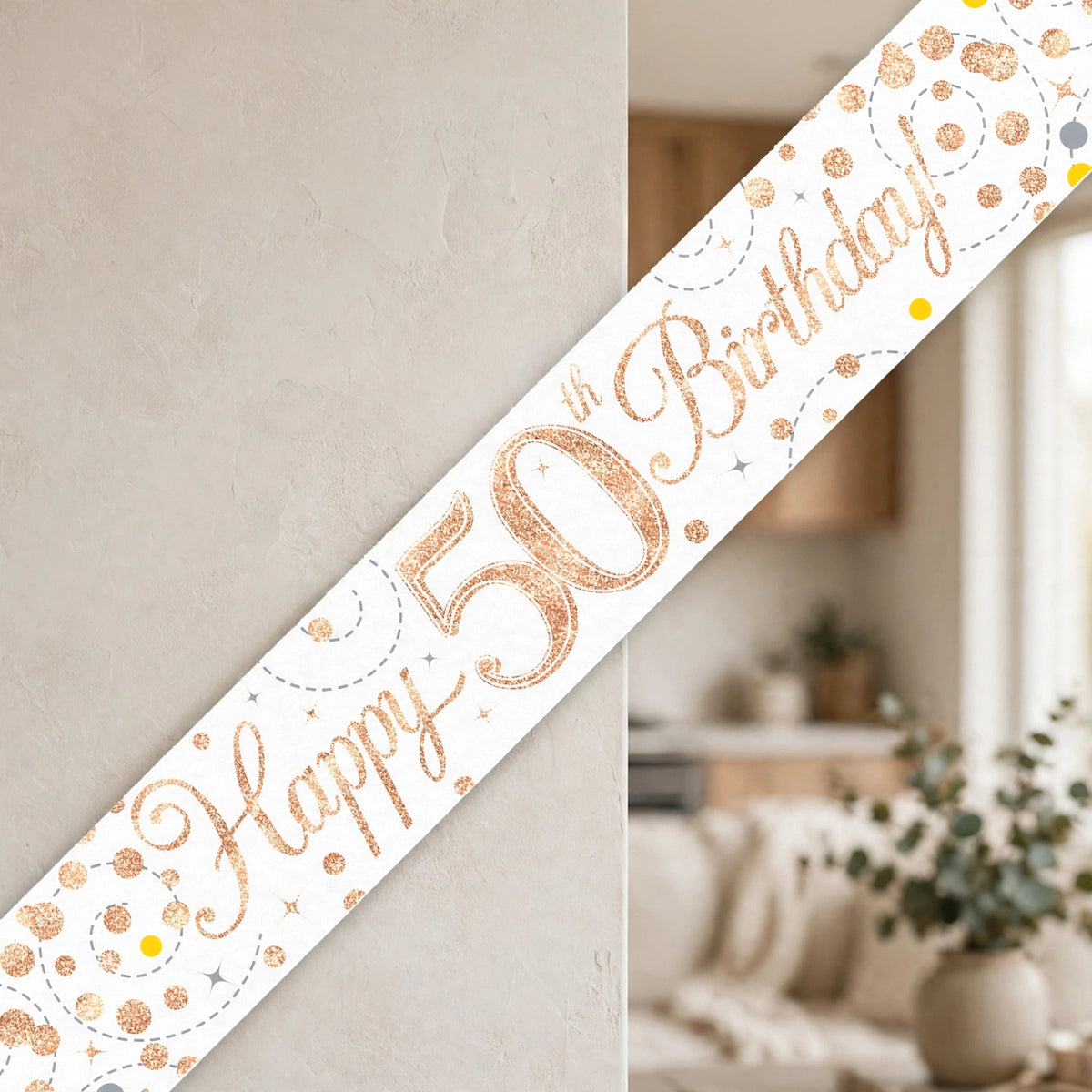 Oaktree Sparkling Fizz 50th Birthday Banner displayed as party decoration in rose gold and white