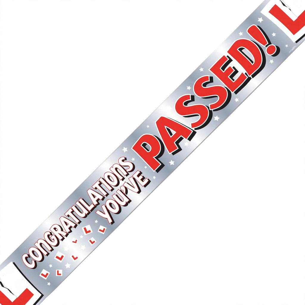 Close-up of colourful You've Passed Your Driving Test text on paper banner