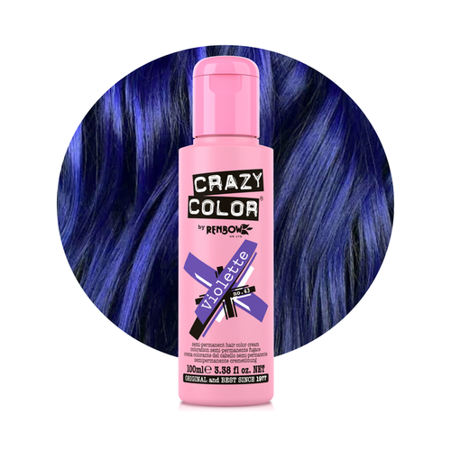 Pink bottle of Crazy Color hair dye with blue hair in the background