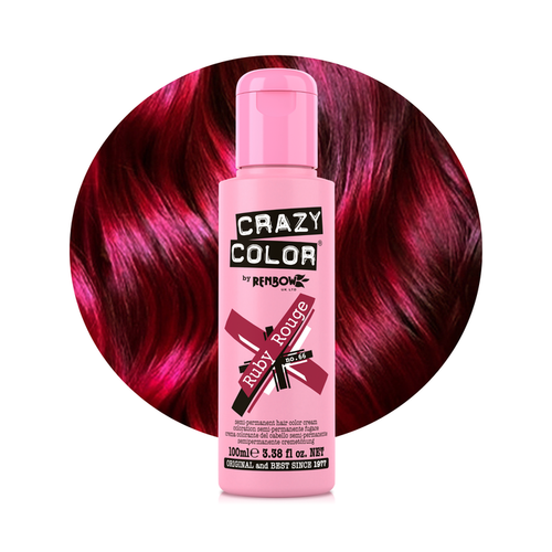 Pink bottle of Crazy Color hair dye with red hair in the background
