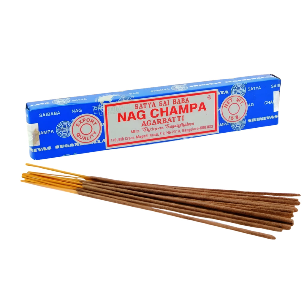 A box of Nag Champa Agarbatti incense sticks with several brown incense sticks fanned out in front on a plain white background.