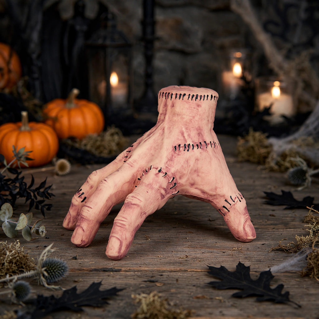 The Thing latex prop hand displayed as a Halloween decoration or photo prop