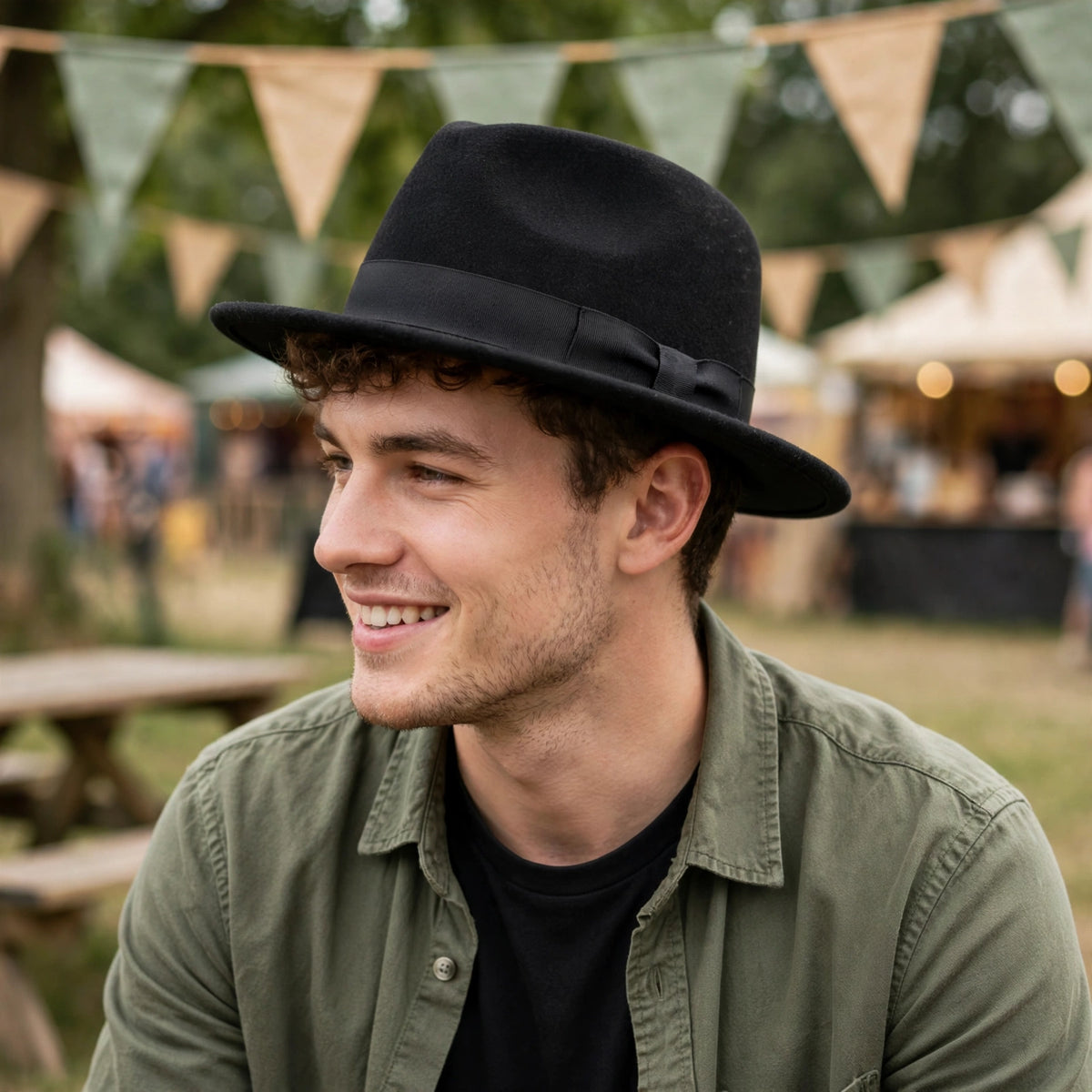Adults black trilby fedora style hat worn for fancy dress, festivals, or themed nights out