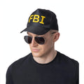 Black and yellow F.B.I baseball cap with bold yellow lettering
