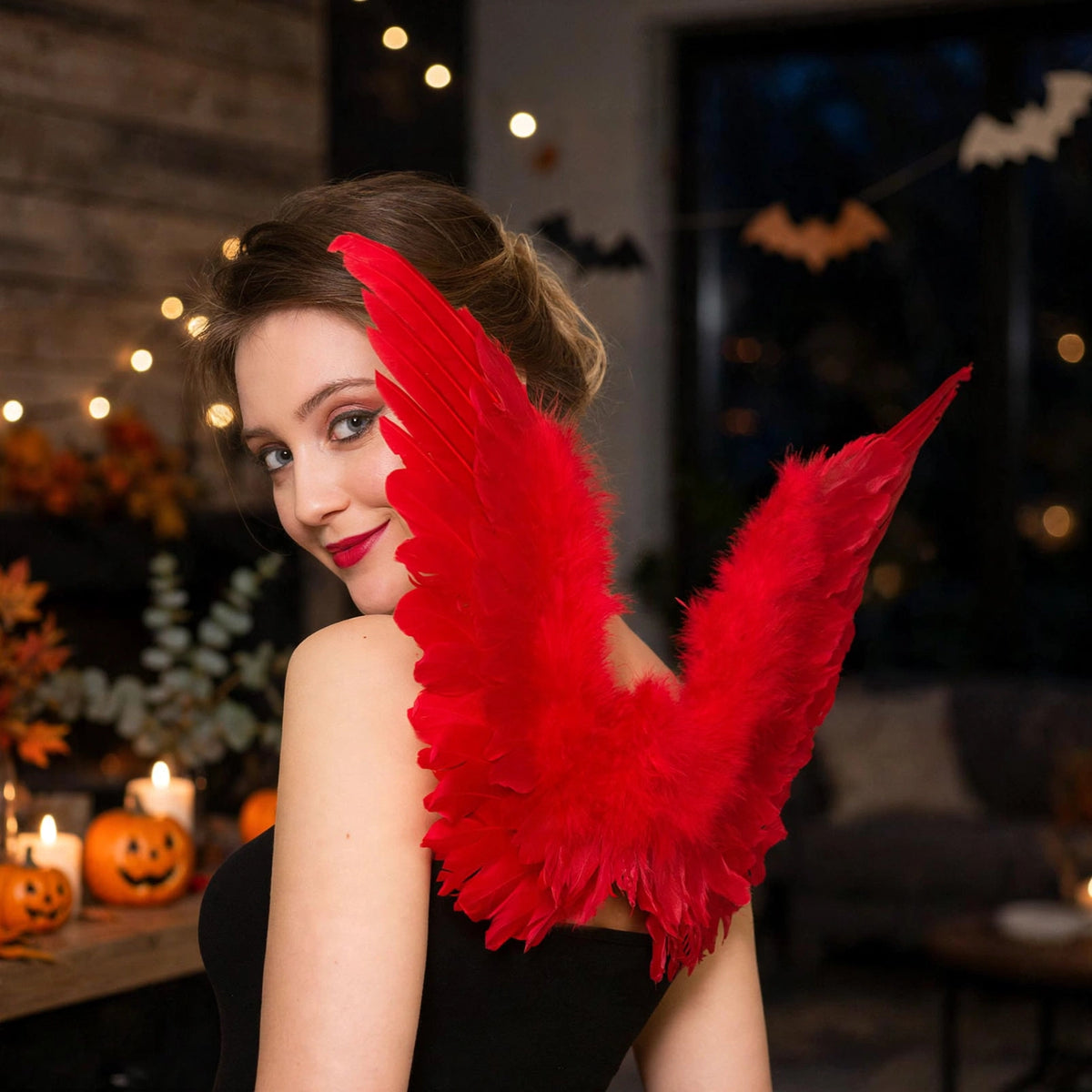 Adults Small Red Feather Angel Wings displayed in a costume setting