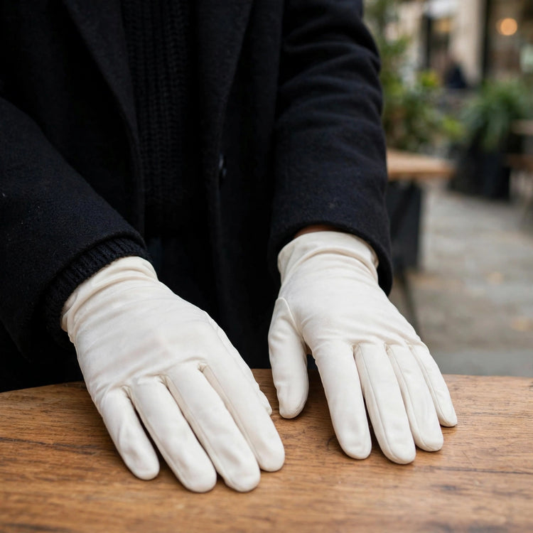 Adults white short gloves worn with an outfit showing wrist exposure