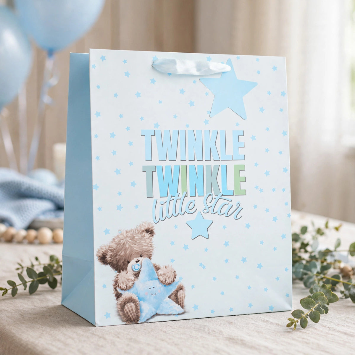 Large blue gift bag with Little Star Boy design used for presenting a baby boy gift