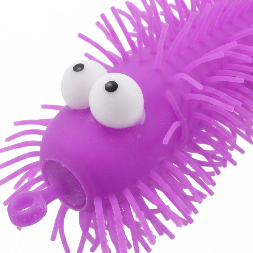 Close-up view of Big Eye Puffer Caterpillar showing spiky puffer spines and googly eyes