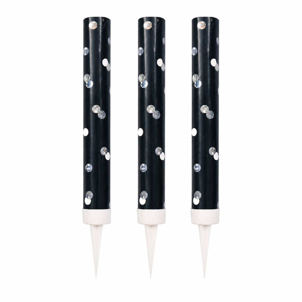 Three black cake fountains showing silver dots collars and spikes
