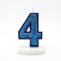 Blue Glitter Number 4 Birthday Candle with white wax body and blue glitter outline