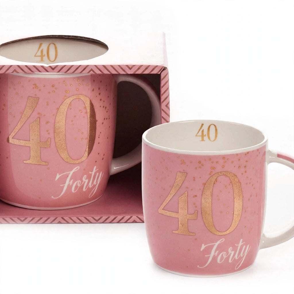 Close-up view of boxed birthday gift mug with pink and gold age 40 design