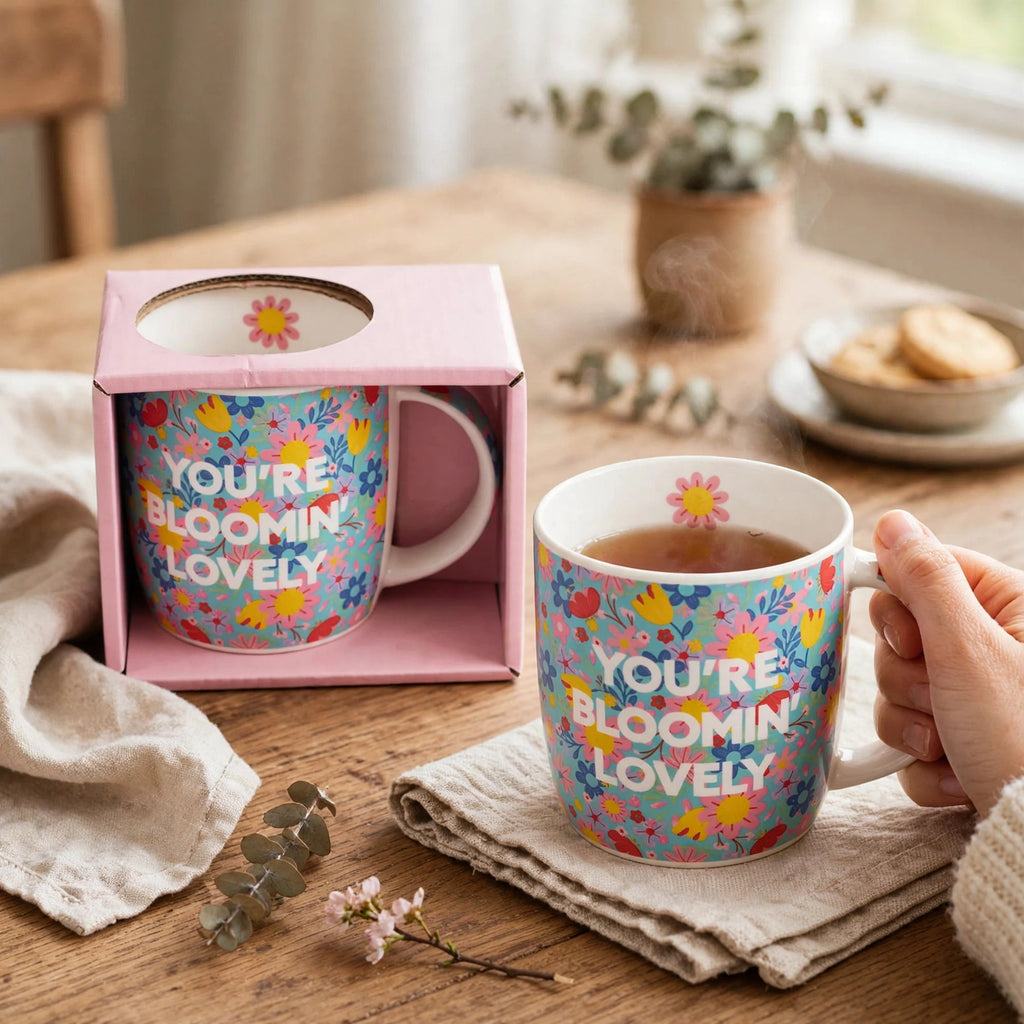 Tiger ceramic mug with floral pattern and You're Blooming Lovely message displayed in kitchen setting
