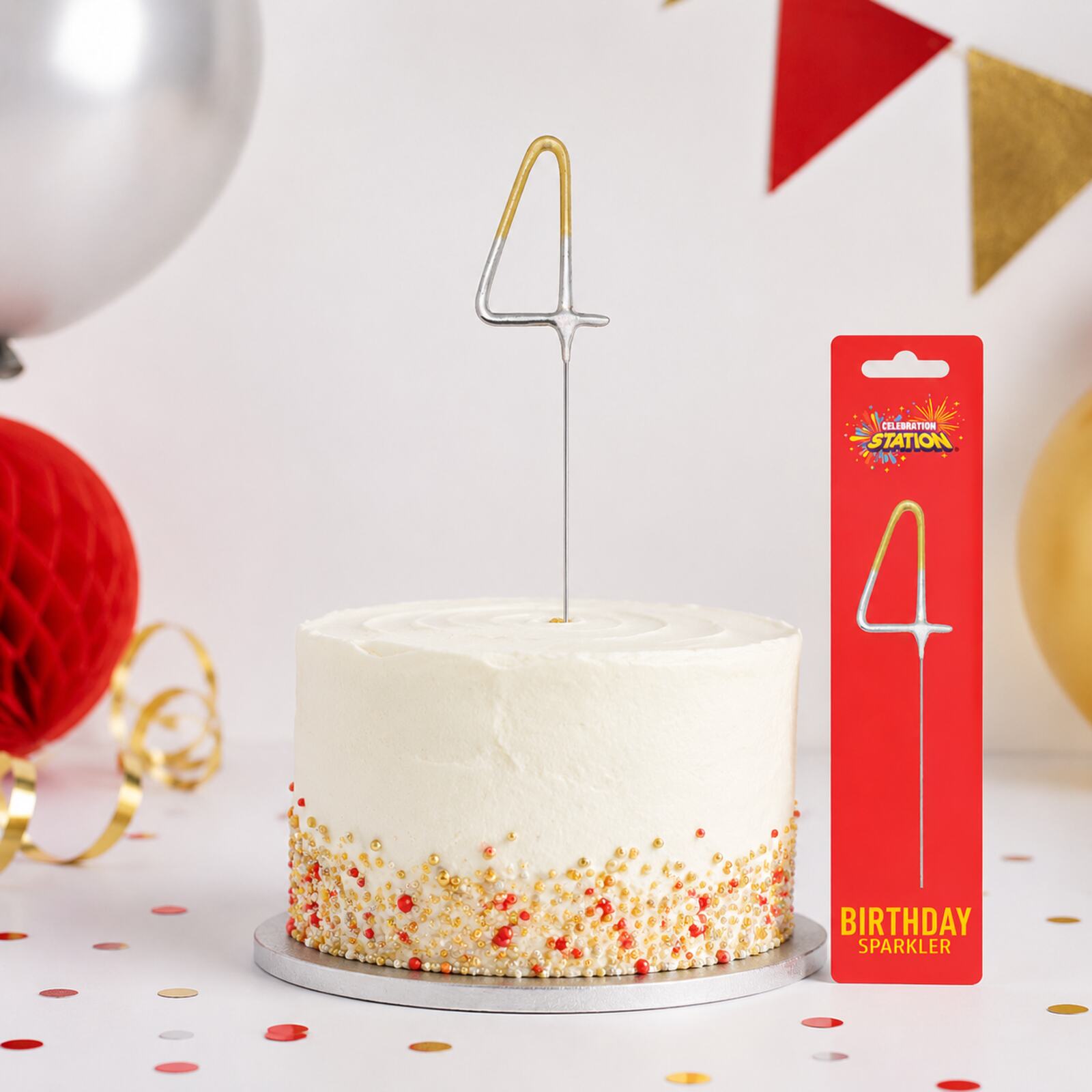 Unlit gold and silver number 4 birthday sparkler displayed in a celebration cake