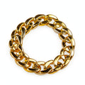 Chunky gold plastic bracelet with oversized gold-tone chain style