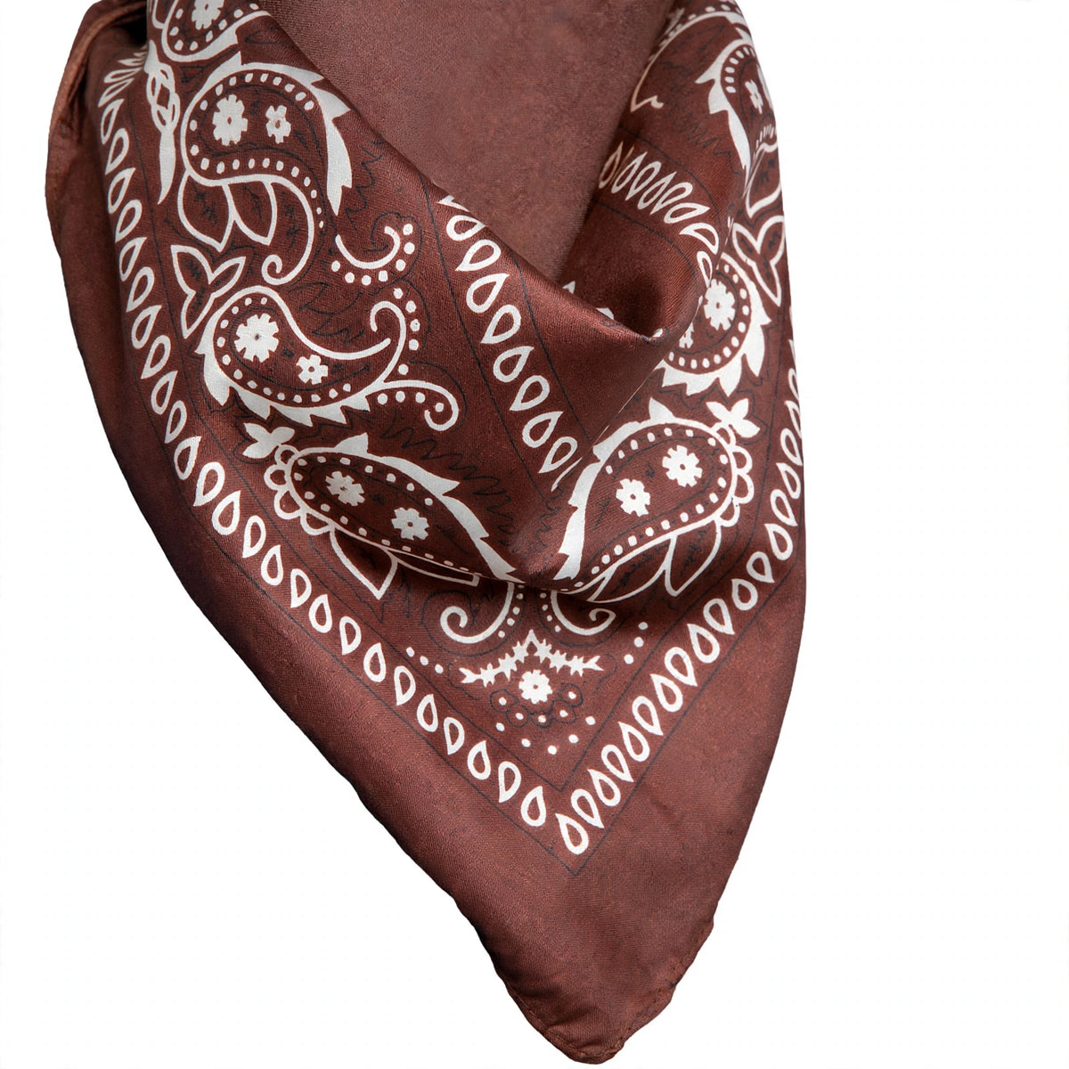Close-up view of brown and white western print bandana