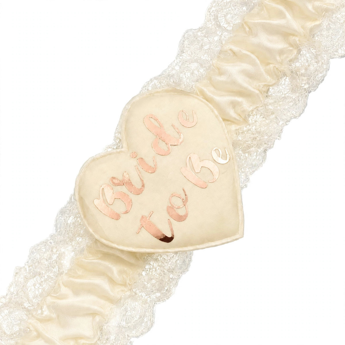 Close-up of heart-shaped Bride To Be centre on cream and gold garter
