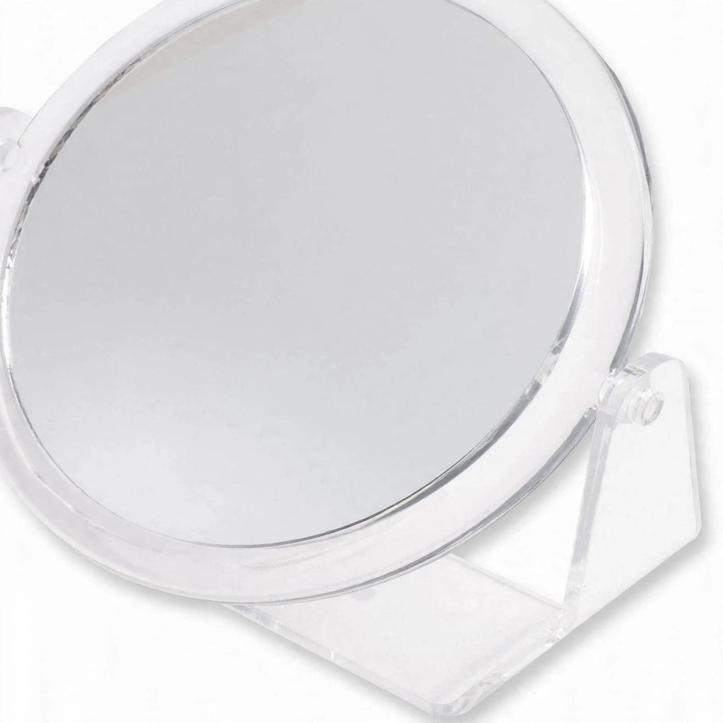 Close-up of Lisseau double sided mirror highlighting clear acrylic frame and rotating stand