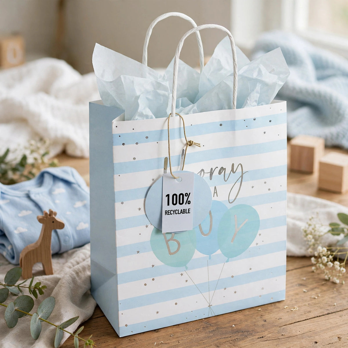 Eurowrap Hooray Baby Boy medium gift bag displayed with baby shower gifts