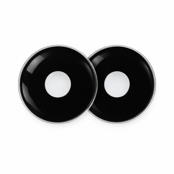 Two round black contact lens-shaped pieces with a glossy finish and a silver rim, displayed on a clean white background.