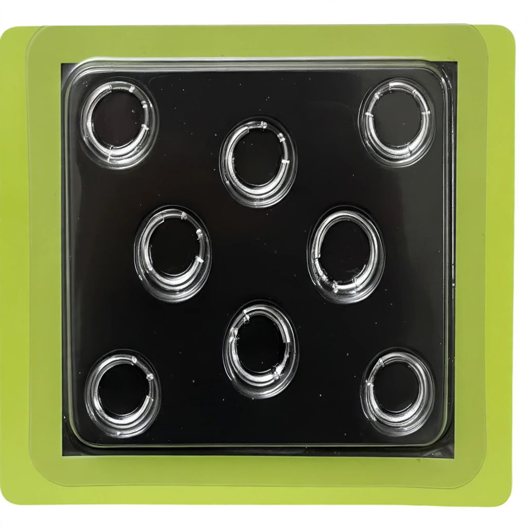 Close-up view of silver chrome clip-on hoop rings from the Fake Piercings Set 8-Pack