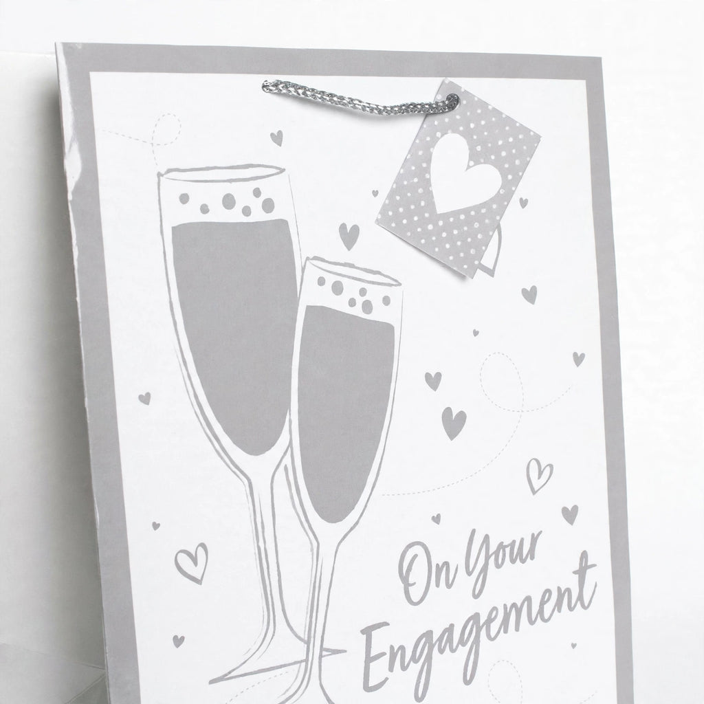 Close-up view of Gift Bag Engagement Champagne Large Portrait showing silver and white design