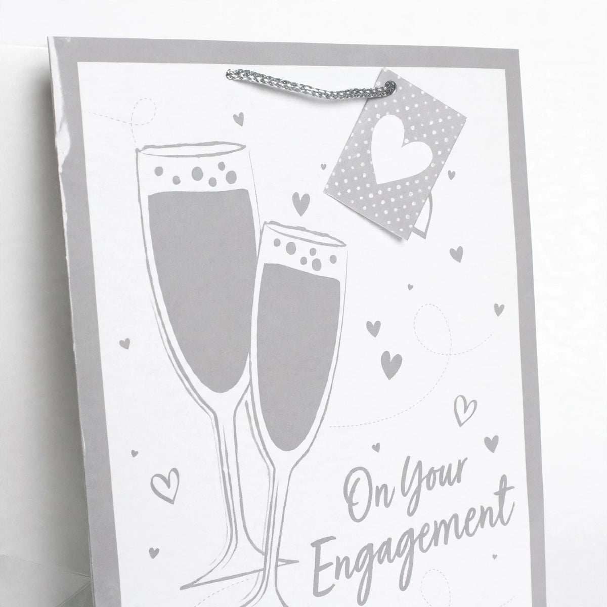 Close-up view of Gift Bag Engagement Champagne Large Portrait showing silver and white design