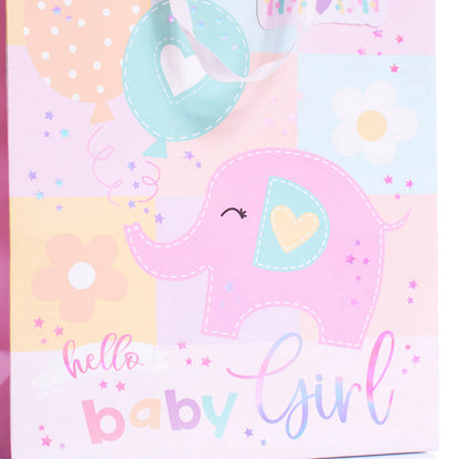 Close-up of pink gift bag with elephant design and Hello Baby Girl printed message