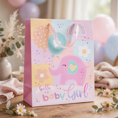 Pink gift bag with Hello Baby Girl message displayed for baby shower or newborn celebration