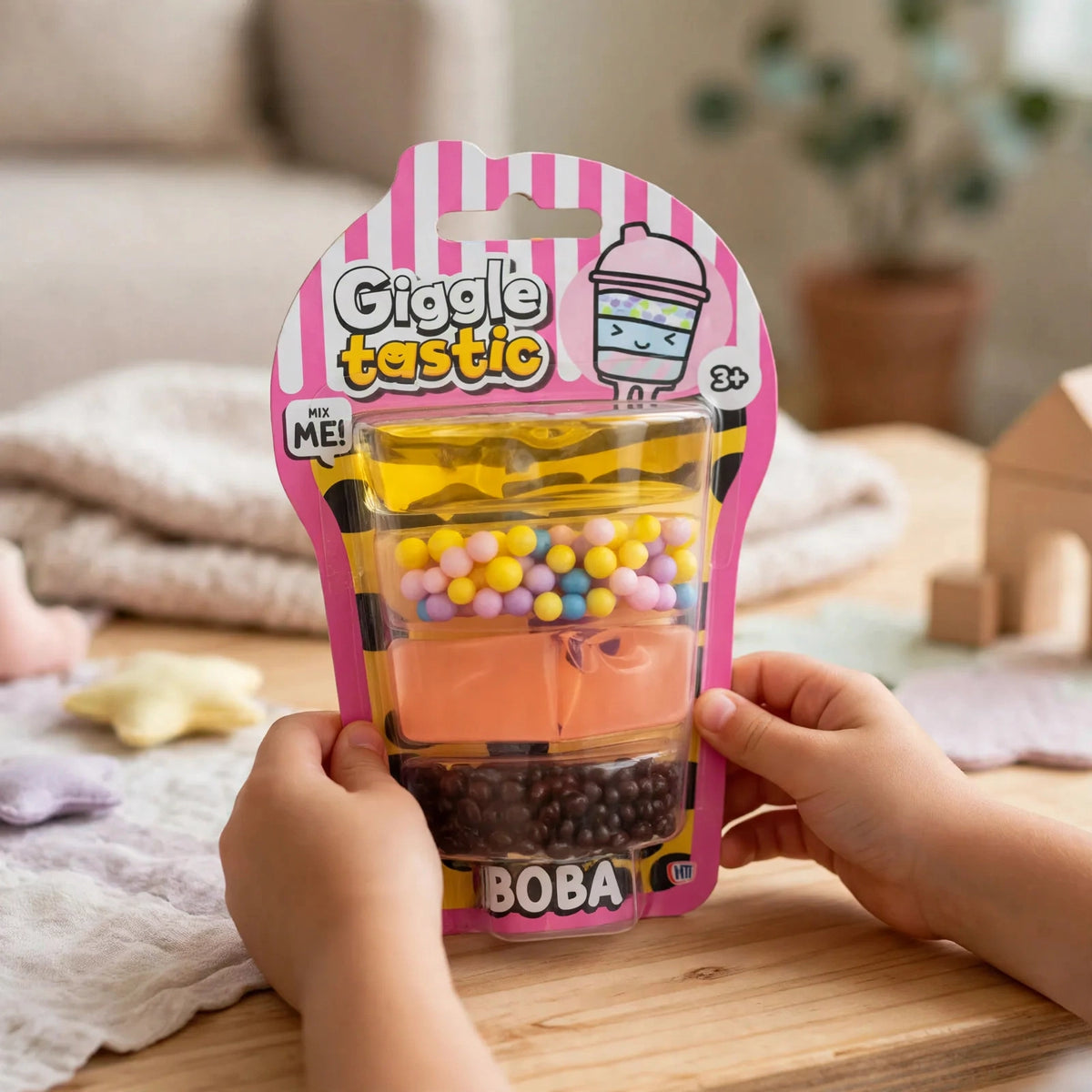 Child playing with the Giggletastic Boba-Themed Slime Stack Toy engaging in tactile sensory play