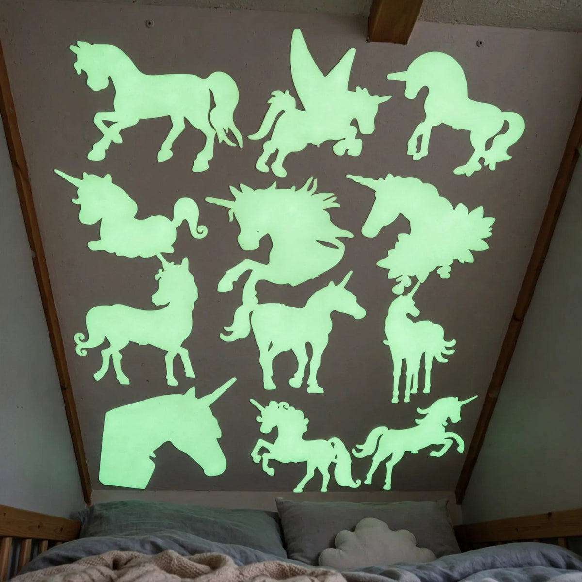 Glow In The Dark Stick On Unicorns applied on walls and ceiling in a child's bedroom