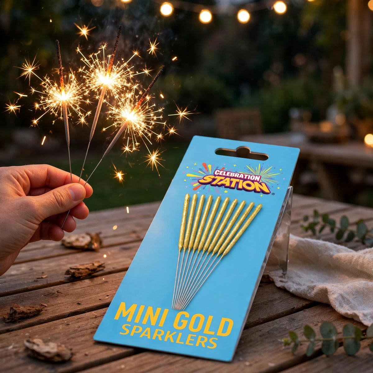 Gold mini sparklers being used outdoors at a celebration