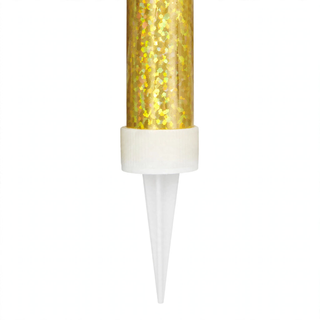 Close-up of gold prismatic ice fountain cake decoration showing foil wrapping and pointed spike