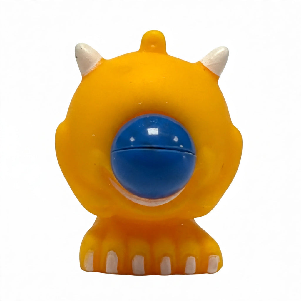 Close-up view of the Google Eyed Squeeze Monster showing its soft squeeze material and googly eyes