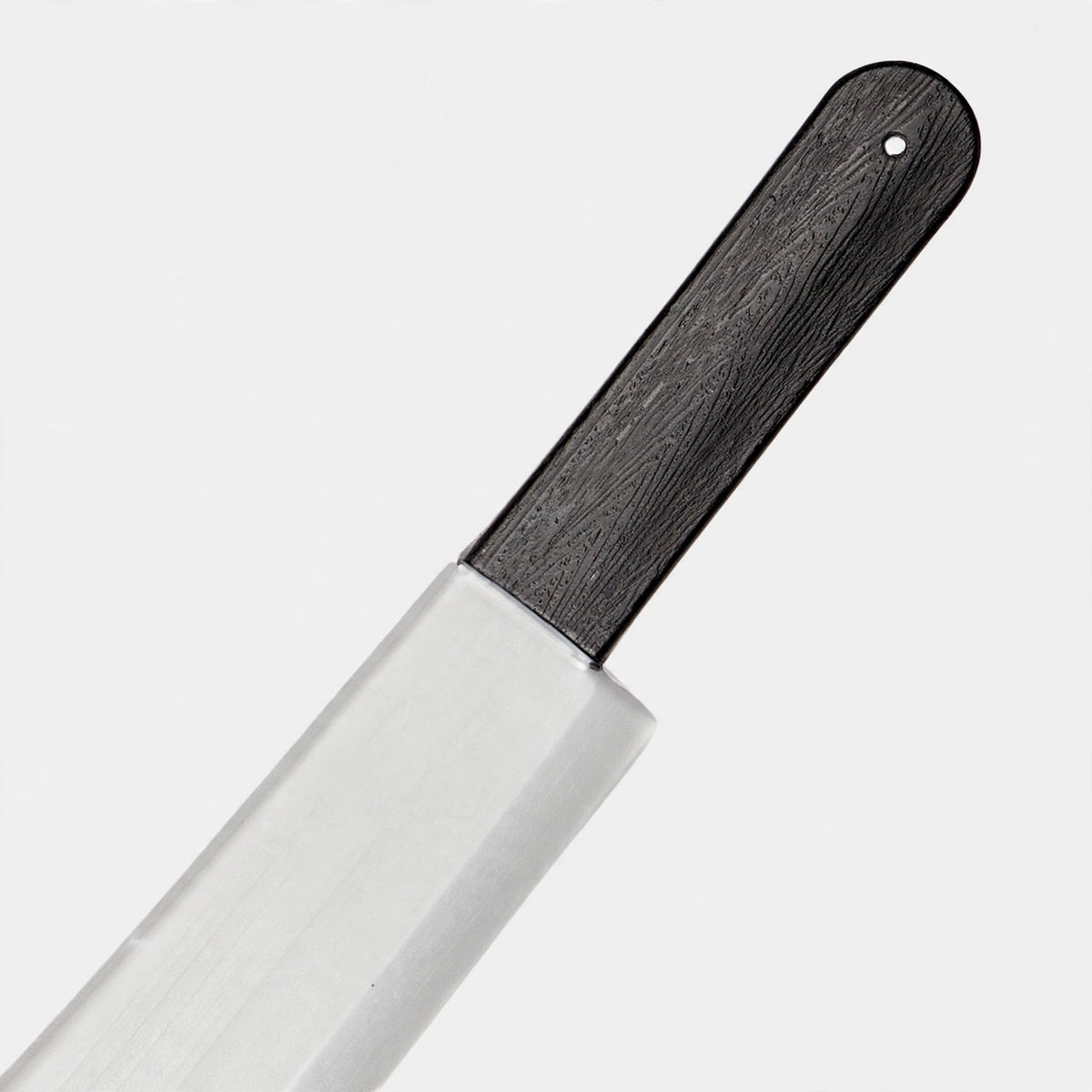 Close-up view of Halloween machete showing black and silver colours