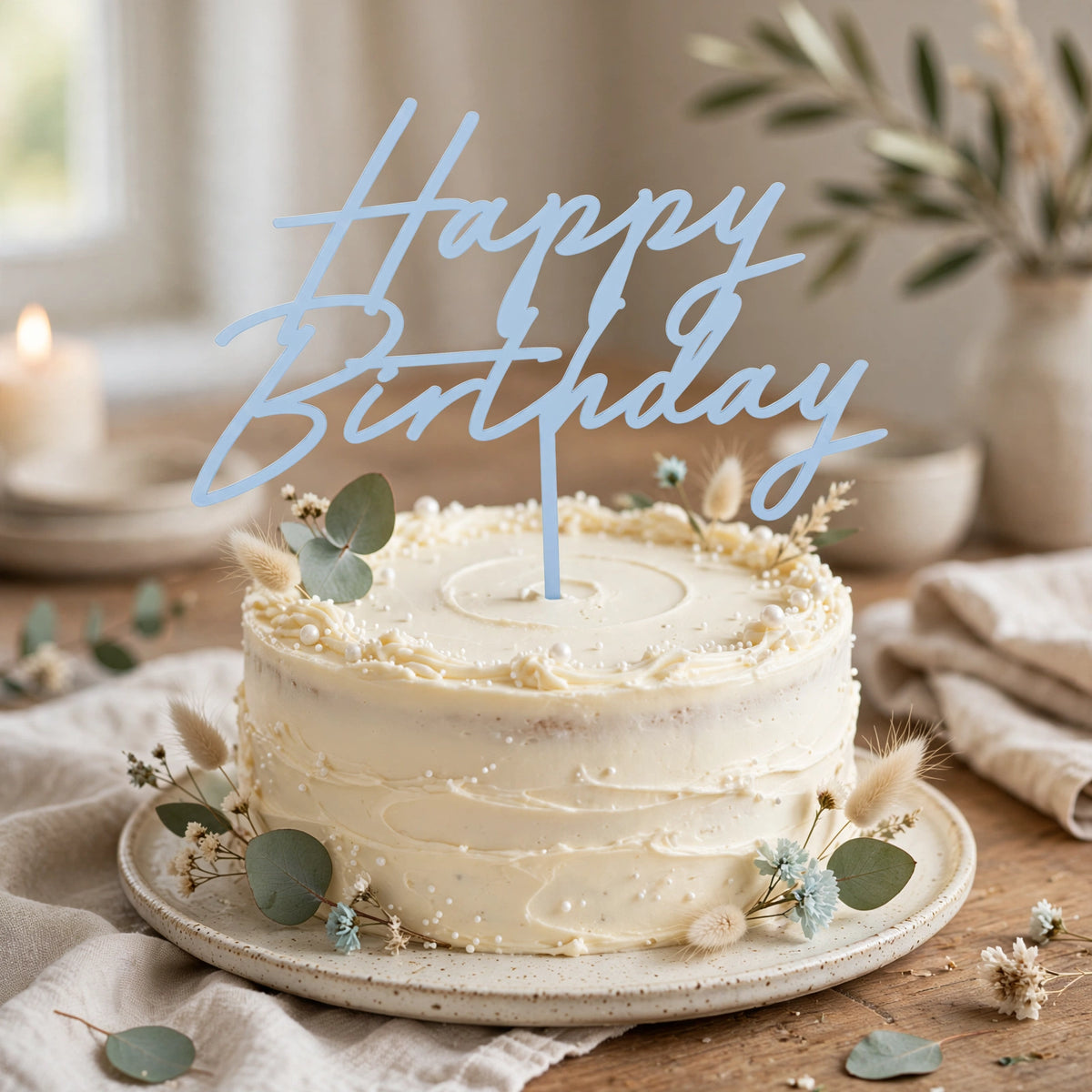 Misty blue acrylic Happy Birthday cake topper displayed on a birthday cake